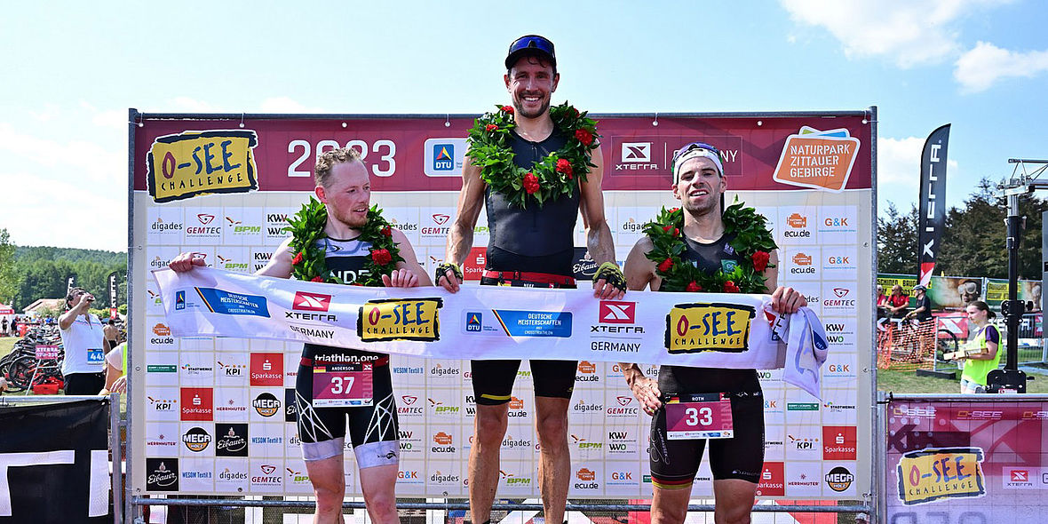 Das Crosstriathlon DM-Podium der Männer: Scott Anderson, Sebastian Neef und Jens Roth (v.l.)