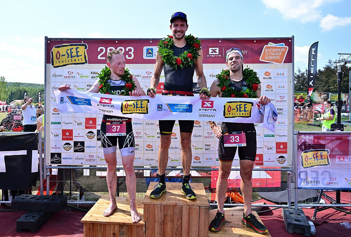 Das Crosstriathlon DM-Podium der Männer: Scott Anderson, Sebastian Neef und Jens Roth (v.l.)